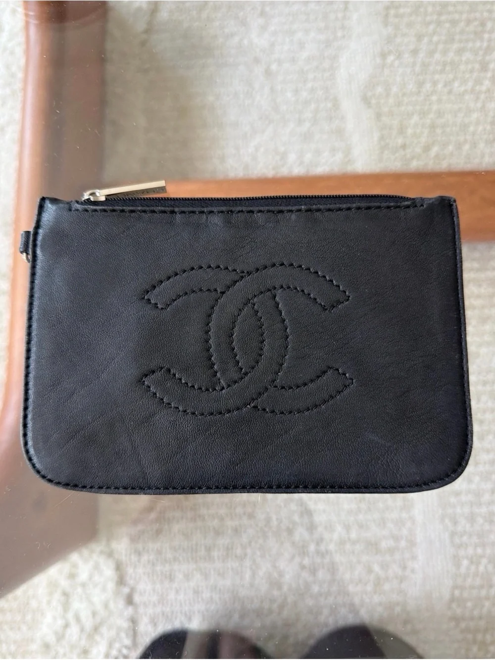 CHANEL CC Black Leather Zip Wallet with Branded Silver Pull.